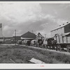 Wagonloads of cotton waiting at the gin of Delta and Pine Land Company of Mississippi, one of the largest plantations in the Delta. Mississippi Delta, Mississippi