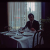 Man seated at dining table, 1057 Restaurant