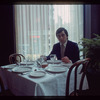 Man seated at dining table, 1057 Restaurant