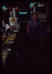 Restaurant worker in blue shirt at serving station, Nea Hellas