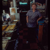 Restaurant worker in blue shirt at serving station, Nea Hellas