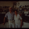 Two bakery workers in front of counter, Poseidon