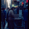 Pretzel vendor wearing brown shirt