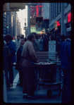 Pretzel vendor wearing brown shirt