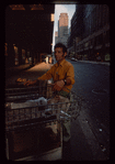 Pretzel vendor wearing yellow shirt