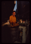 Pretzel vendor wearing yellow shirt