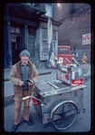 Pretzel vendor wearing hat