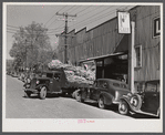 Tobacco is taken in trucks from warehouse to cigarette factories. Durham, North Carolina
