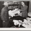 Black farmer unsatisfied with price offered him by one cotton buyer takes his samples up the street to another [white] buyer. Clarksdale, Mississippi Delta