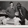 Black farmer who has brought his cotton samples to town discusses price with [white] cotton buyer. Clarksdale, Mississippi Delta, Mississippi