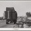 Truck with bales of cotton from Hopson Planting Company gin going up highway to warehouse near Clarksdale, Mississippi Delta