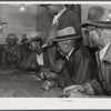 Black people gambling with their cotton money in a juke joint outside of Clarksdale, Mississippi Delta