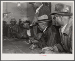 Black people gambling with their cotton money in a juke joint outside of Clarksdale, Mississippi Delta