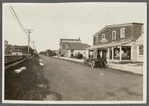 View of Jessup Avenue. Looking north from Quogue Street. B & H Drugstore and automobile dealership on right. Quogue, Southampton