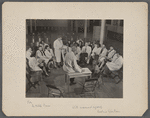 Group portrait of doctors in white coats including Hilde Mosse and Fredric Wertham examining a child