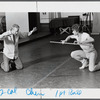 Choreographer William Forsythe showing a movement to Jerel Hilding