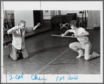 Choreographer William Forsythe showing a movement to Jerel Hilding