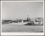 Intersection on main highway with road turning off to right for Wendell. Wake County, North Carolina