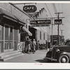 Black people waiting to go to work at one o'clock in warehouse and tobacco stem factory. Wendell, Wake County, North Carolina