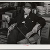 Mr. R.B. Whitley visiting in his general store. He is president of the bank and owns and runs practically all of the town, he is a big landowner, owns Whitley-Davis Farm and a cotton mill in Clayton. He said he cut down the trees and pulled the stumps out