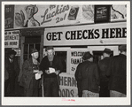 Farmers getting their checks in warehouse office after their tobacco has been sold at auction. Durham, North Carolina