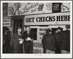 Farmers getting their checks in warehouse office after their tobacco has been sold at auction. Durham, North Carolina