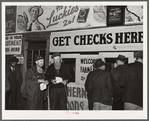 Farmers getting their checks in warehouse office after their tobacco has been sold at auction. Durham, North Carolina