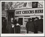Farmers getting their checks in warehouse office after their tobacco has been sold at auction. Durham, North Carolina