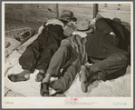 Farmers sleeping in white camp room in warehouse. They often must remain overnight or several days before their tobacco is auctioned. Durham, North Carolina