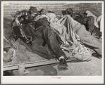 Farmers sleeping in [Black] camp room in warehouse. They often must remain overnight or several days before their tobacco is auctioned. Durham, North Carolina