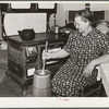 Mrs. Elvin Wilkins (Rosa) churning butter in the kitchen of their home in Tallyho. Near Stem, Granville County, North Carolina. See subregional notes (Odum) November 16, 1939