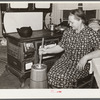 Mrs. Elvin Wilkins (Rosa) churning butter in the kitchen of their home in Tallyho. Near Stem, Granville County, North Carolina. See subregional notes (Odum) November 16, 1939