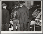 Farmers must often wait overnight or for several days before their tobacco is sold at auction. They sometimes hang around in cafes or pool rooms, sleeping most anywheres. Durham, North Carolina