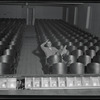 Publicity photograph of Fred Sears sitting in the theatre of the Westchester County Playhouse