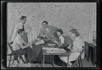 Publicity photograph of Fred Sears and unidentified staff in the office of the Westchester County Playhouse