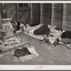 Farmers sleeping in white camp room in warehouse. They often must remain overnight or several days before their tobacco is auctioned. Durham, North Carolina