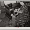 Mrs. Elvin Wilkins (Rosa) churning butter in the kitchen of their home in Tallyho, near Stem, Granville County, North Carolina. See subregional notes (Odum) November 16, 1939