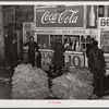 Lunch stand and tobacco inside entrance to warehouse at end of auction sale. Durham, North Carolina