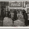 Lunch stand and tobacco inside entrance to warehouse at end of auction sale. Durham, North Carolina