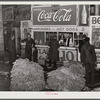 Lunch stand and tobacco inside entrance to warehouse at end of auction sale. Durham, North Carolina