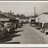 Street in warehouse district during tobacco auction sales. Durham, North Carolina