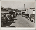 Street in warehouse district during tobacco auction sales. Durham, North Carolina