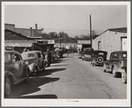 Street in warehouse district during tobacco auction sales. Durham, North Carolina