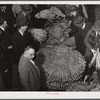 Auctioneer, buyers, and farmers during tobacco auction sale. Warehouse, Durham, North Carolina