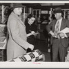 Mrs. Elvin Wilkins (Rosa) buying candy to send away to her daughter at school. She came to Durham with her husband this day to sell their tobacco at auction and do some general shopping. Durham, North Carolina