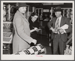 Mrs. Elvin Wilkins (Rosa) buying candy to send away to her daughter at school. She came to Durham with her husband this day to sell their tobacco at auction and do some general shopping. Durham, North Carolina