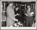 Mrs. Elvin Wilkins (Rosa) buying candy to send away to her daughter at school. She came to Durham with her husband this day to sell their tobacco at auction and do some general shopping. Durham, North Carolina