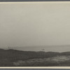 View of rock off shore. Gardiner's Island in distance. Fireplace, East Hampton