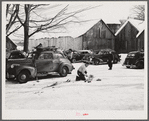 Every available space for parking is used by skiers on weekends at Clinton Gilbert's farm. The house is about 8 years old; purchased by Gilbert in 1929. He has about 150 acres, mainly a dairy farm with 23 cows. He also makes about 100 gallons of maple