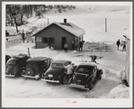 Every available space for parking is used by skiers on weekends at Clinton Gilbert's farm. The house is about 8 years old; purchased by Gilbert in 1929. He has about 150 acres, mainly a dairy farm with 23 cows. He also makes about 100 gallons of maple